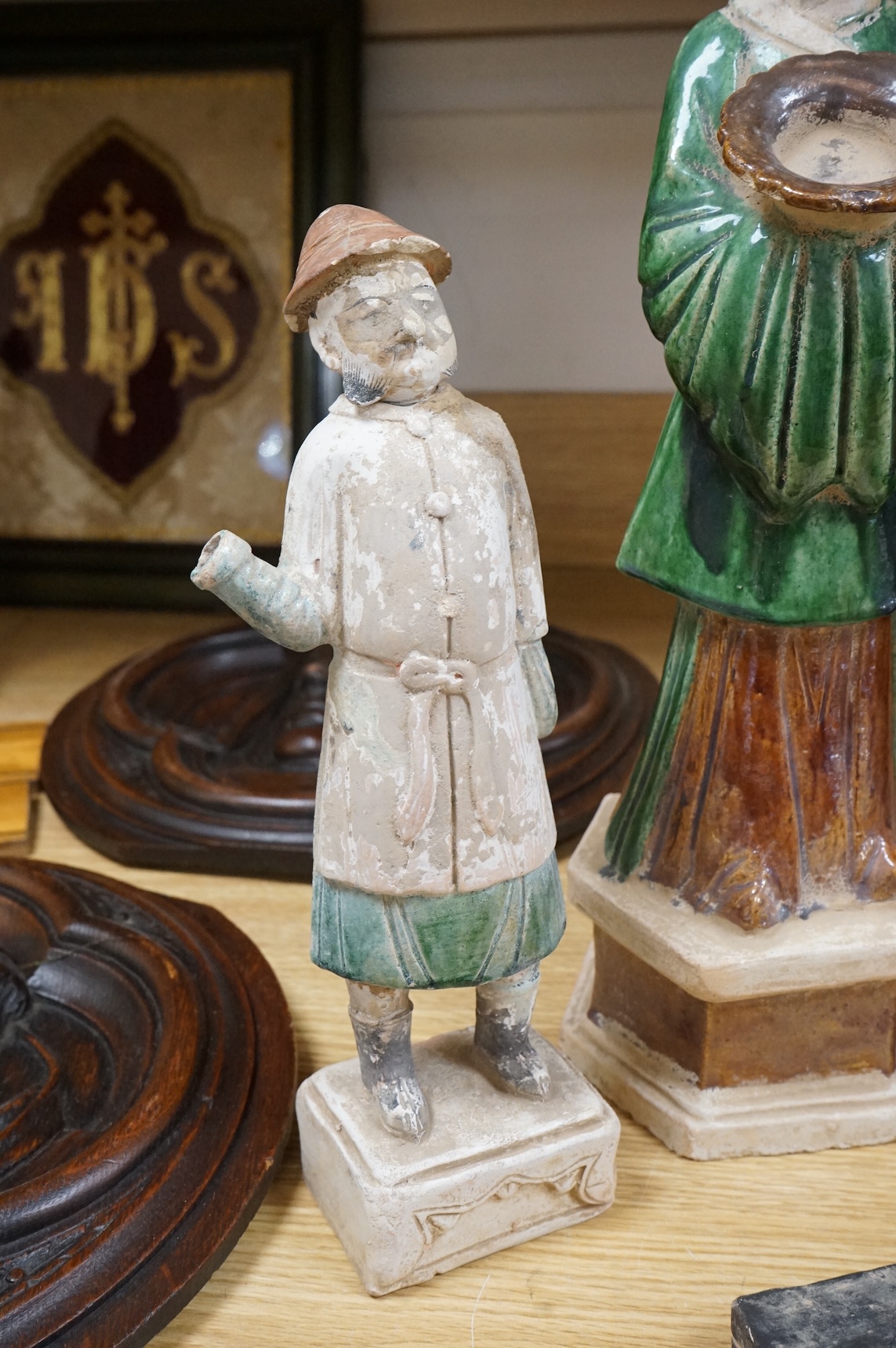 Three Chinese Ming sancai glazed figures of attendants, tallest figure 46cm